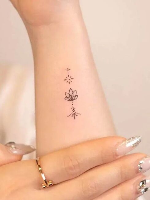 Minimalist Lotus Tattoo
