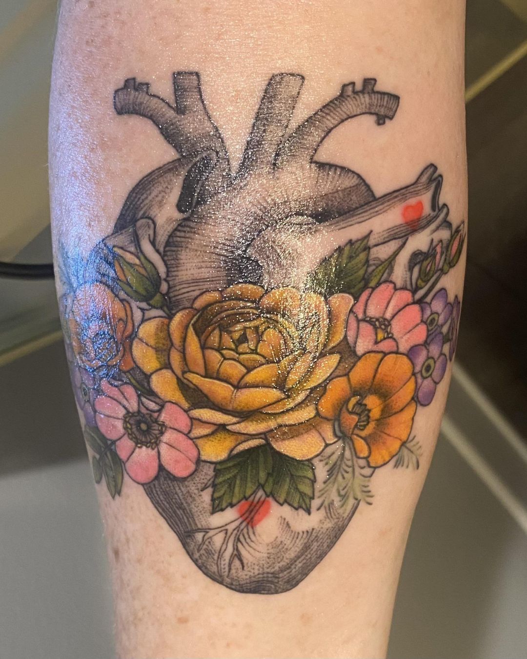 The Meaning Behind Floral Anatomical Heart Tattoos