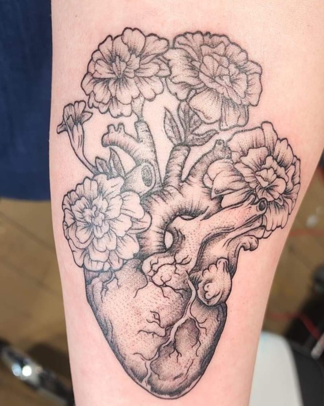 The Meaning Behind Floral Anatomical Heart Tattoos